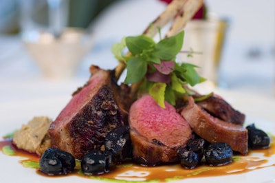 Seared baby lamb rack with macerated cherries and basil oil from Yum Yum Chefs.