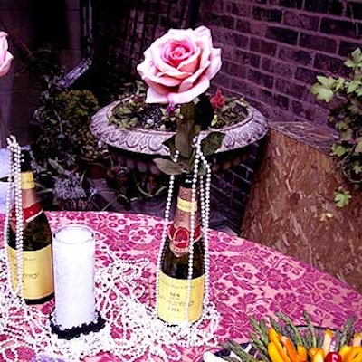 The limited decor included champagne bottles with pearls and roses.