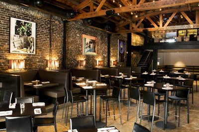 The venue features exposed brick walls and wooden beams.