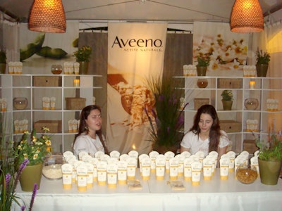Aveeno representatives passed out free bottles of sunscreen from their cabana.