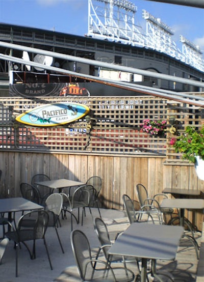 Vines on Clark's rooftop bar is a baseball's throw from Wrigley Field. Simple lattice walls, beer signs, and flower pots evoke a backyard barbecue feel.