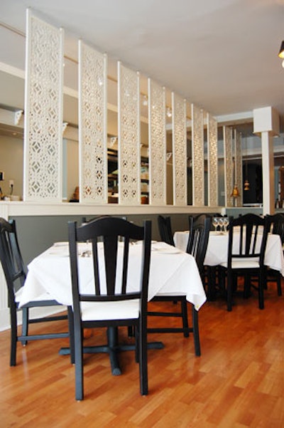 Traditional Indian screens separate the dining room from the kitchen.