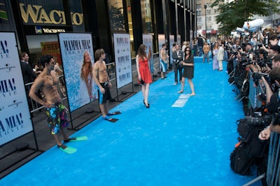 The film's cool Mediterranean colors showed up at the premiere in the unconventional aqua carpet.