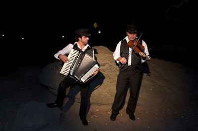 Greek musicians playing the accordion and violin greeted guests as they arrived at the Boathouse.