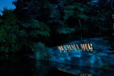 A projection of the film's title lit up the rocks on the lake for the guests mingling on the water's edge.