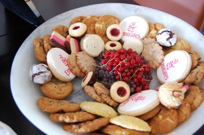 Sweets laid out inside the Emirates Airlines suite include cookies bearing the company's logo.