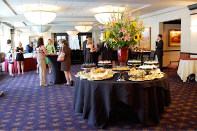 The cupcake table was topped with a lily and sunflower centerpiece.