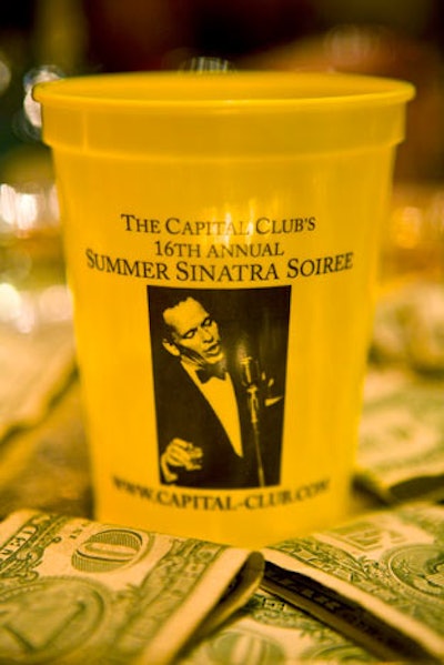 Signature cups, emblazed with the event's imagery, decorated each cocktail table.