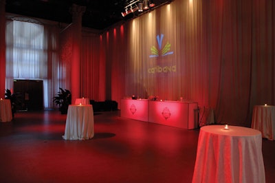 Two white bars sat below a projection of the Caribana logo in the Artifacts Room, where the V.I.P. reception took place prior to the dinner.