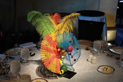 Centrepieces created by Walter Elliot featured colourful feathers, hats, and masks taken from Caribana parade costumes.