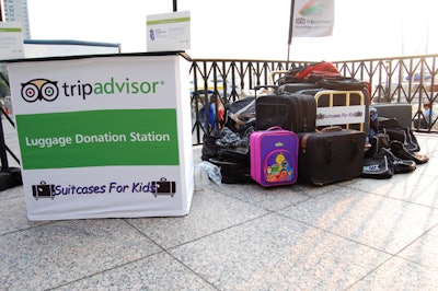 One station marked the area in which people could donate bags and other pieces of luggage for Suitcases for Kids.