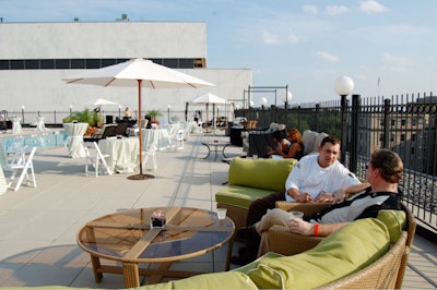 The event incorporated the Liaison Capitol Hill's temporary cabana-style rooftop funiture, including white canvas umbrellas and brown rattan sofas with lime green cushions.