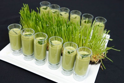 Limelight Catering's hors d'oeuvres included chilled asparagus soup presented on a tray adorned with grass.