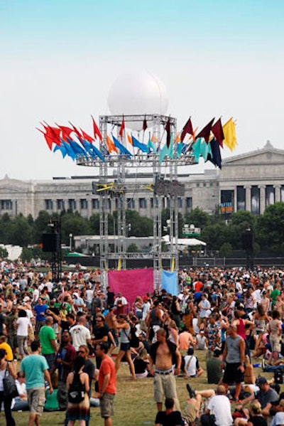 A tower of speakers topped with colored flags sat near the south end of Grant Park.