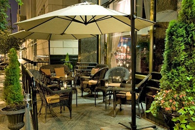 The sidewalk patio, which overlooks Franklin Park, can hold up to 50 guests for a reception and can be divided into two spaces.