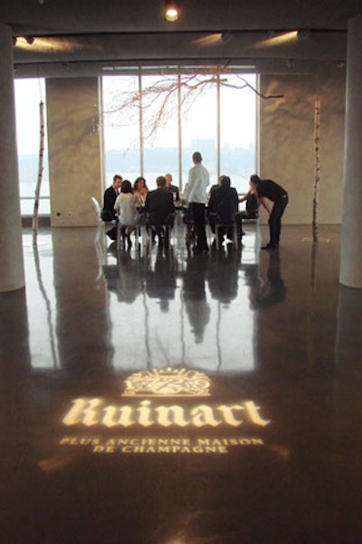 Making use of the venue's floor-to-ceiling windows, the event featured very little in the way of lighting, except for a logo projection on the floor.