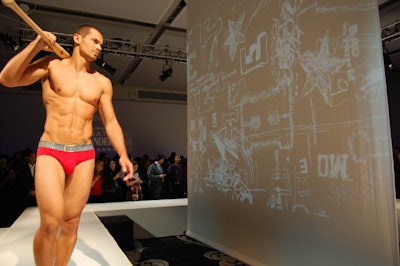 Each model during the Diesel show walked down the runway with different sports paraphernalia.