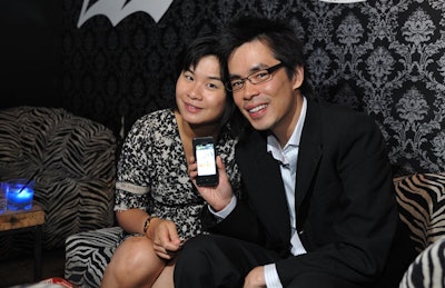 Guests posed with the new Samsung Instinct phone, which launched in stores August 8.