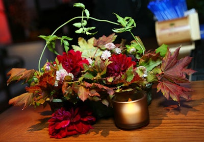 Clusters of flowers and foliage sat on tables.