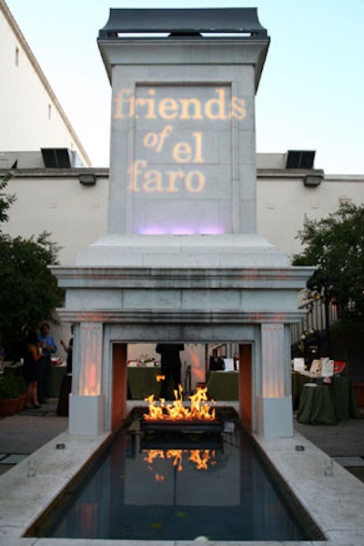 A Friends of El Faro gobo decorated the fireplace in the courtyard.