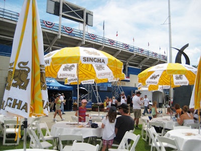 The tournament's official beer sponsor, Singha, emblazoned umbrellas in the food court with its logo.