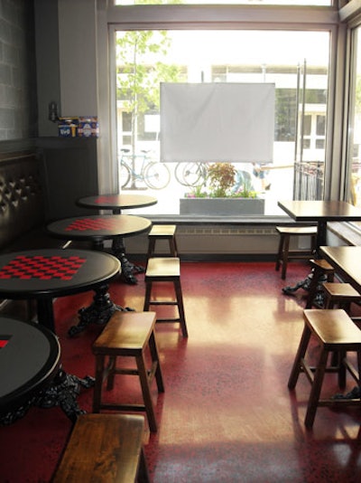 The bar area includes a series of chess tables.