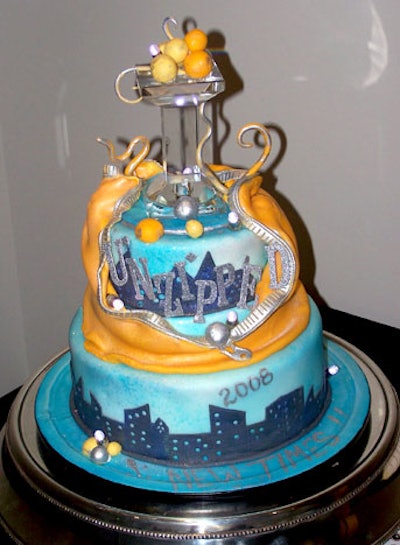 Catering by Chef Jackie created a specialty cake featuring a downtown cityscape for the event.