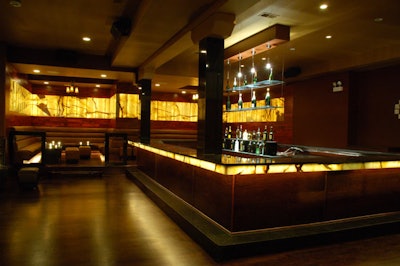 Club Royale's decor features leather booths, hardwood floors, and back-lit slabs of Italian onyx.