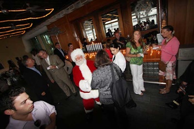 As part of the winter holiday theme, an actor dressed as Santa mingled with the guests throughout the night.