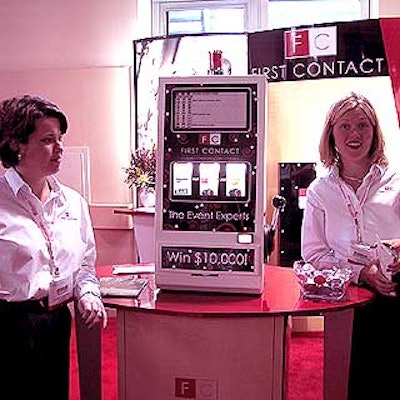Kim Kopetz and Jenny Brinkley of First Contact showed off their promotional slot machine made by SCA Promotions.