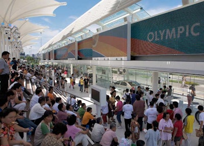 Footage of its cars and highlights from the Olympic Games play on the giant screen at the Volkswagen pavilion.