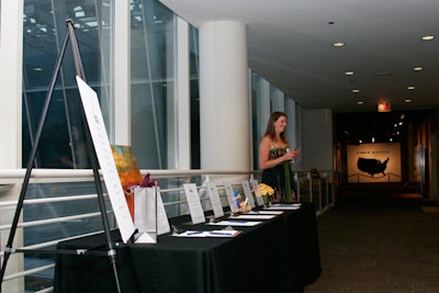 A silent auction table featured items divided in categories such as Chicago sports and health and wellness.