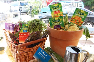 Clay pots and baskets filled with vegetables displayed signs with the nutritional features of the new products.