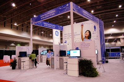 The largest at the pavilion, GE's white-carpeted display included computer stations and information on the company's healthcare equipment.