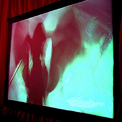Flicker Fusion's cool shadow dancing setup showed the people dancing among swirling, colorful projections at the opening night party for Gen Art's Summer Arts Festival.