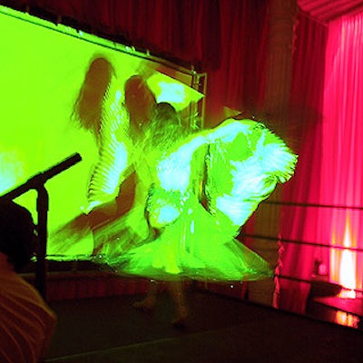 One of the belly dancers from Amira Mor danced in front of Flicker Fusion's screen.