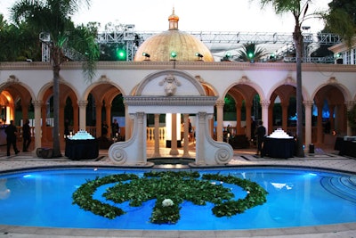 A floral piece in the shape of one of Dubai's manmade islands floated on the pool's surface.