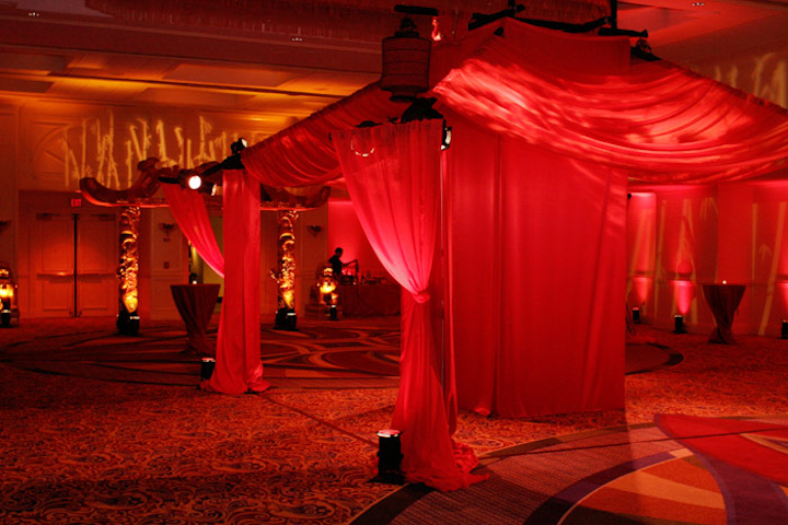 Floor-to-ceiling red drapes sectioned off the Chinatown area, which offered palm readers and fortune cookies filled with GE slogans.