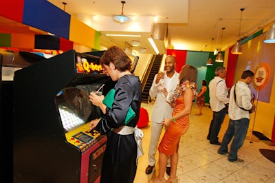 During the Pop Candy Arcade-themed after-party, guests played vintage video games like Q-Bert and Pac-Man.