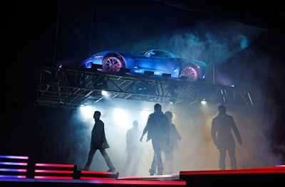 During the fashion show, a Corvette from event sponsor Chevy descended onto the stage in a cloud of smoke.