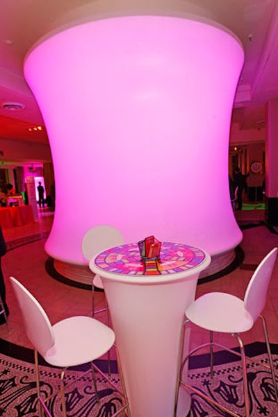 In Macy's Narcissus Room, Frost's Denis Remer masked a fountain with a giant lit-from-within spandex drum.
