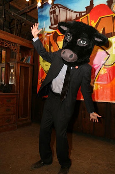 A cow-headed mascot from La Cense Beef, an event sponsor, worked the room.
