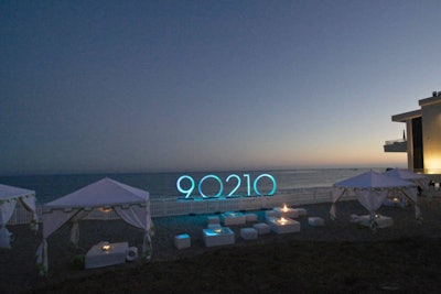 Kinetic illuminated a display that read 90210 and the ocean behind it.