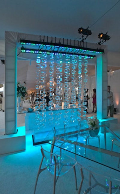 A beaded ice curtain popped under blue lights.