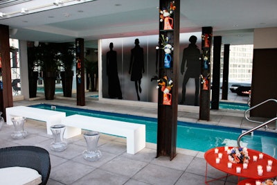 Silhouettes on frosted glass in the pool area provided a subtle hint to the event's fashion tie-in.