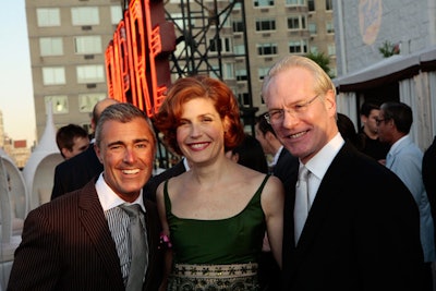 Tim Gunn (right) and former Project Runway contestant Laura Bennett joined guests at the launch.