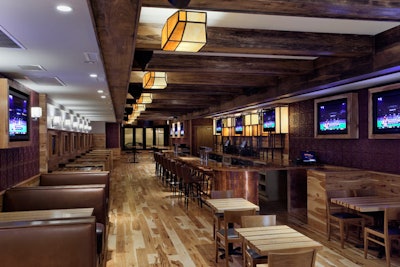 The Pony's first floor features leather booths, a copper-topped bar, flat-screen TVs, and cut-glass fixtures.