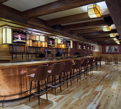 The 38-foot copper-topped bar features bucket-style barstools.