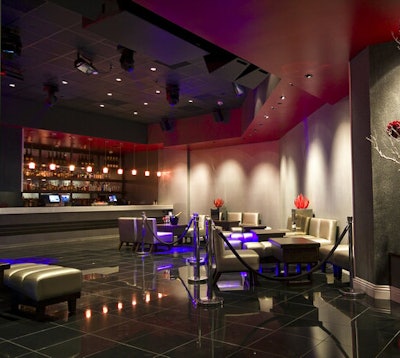 Silvery ottomans provide seating.