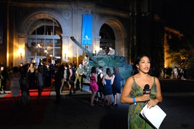 An army tank and reconnaissance vehicle surrounded the red carpet where guests entered the gala.